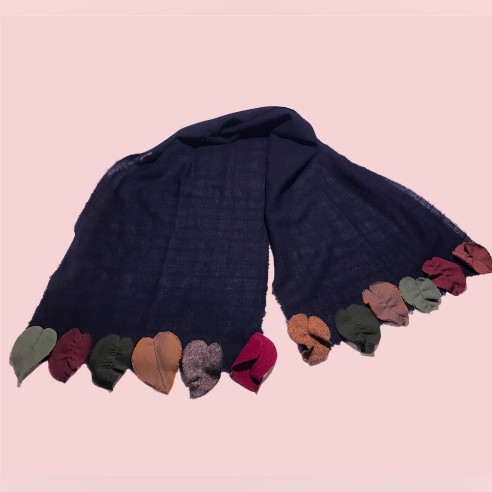 Black artisanal scarf/muffler with leaf trim in multiple fabrics.
